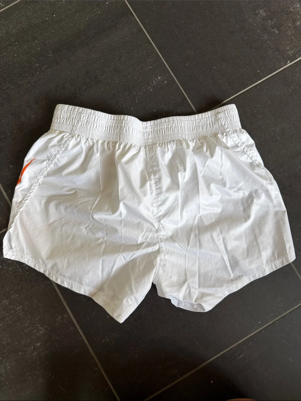 Nike Women’s White Athletic Shorts with Orange Swoosh size XS